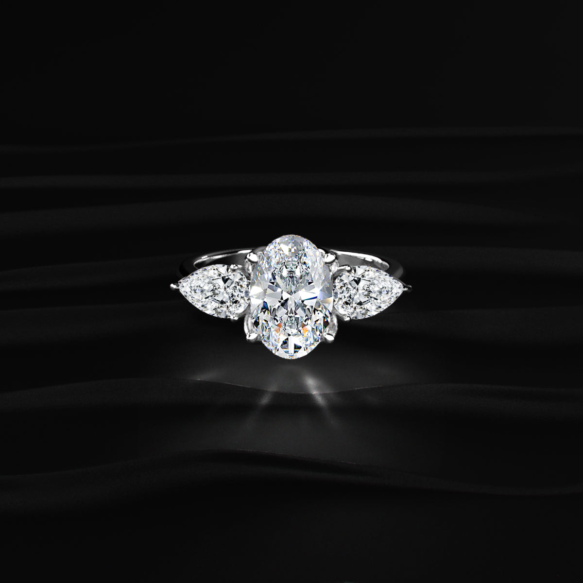 Oval Diamond Triology Ring In Floral Setting With Side Pear