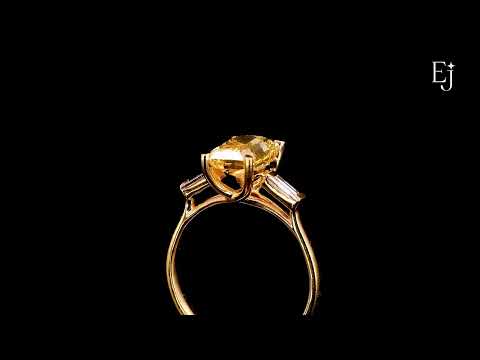 Load video: Yellow Radiant Solitaire Engagement Ring With Tapered Baguette | Earthly Jewels