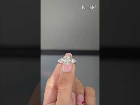 Load video: Oval Diamond Triology Ring In Floral Setting With Side Pear | Earthly Jewels