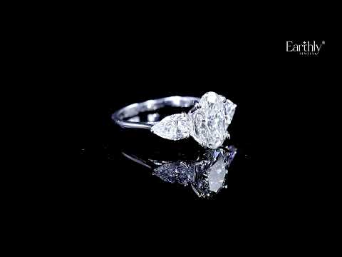 Load video: Oval Diamond Triology Ring In Floral Setting With Side Pear | Earthly Jewels