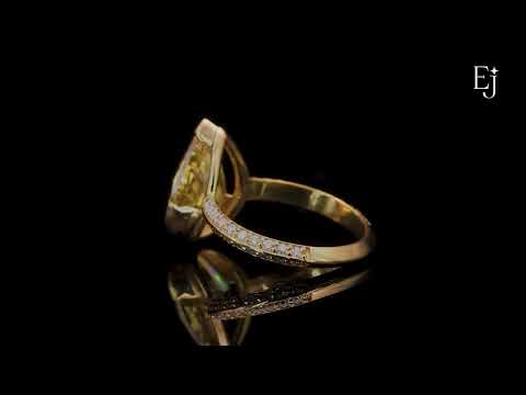 Load video: Yellow Pear Diamond Half Bezel Pave Ring | Earthly Jewels