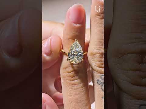 Load video: Pear Shaped Diamond Fluid Ring With Stack Band | Earthly Jewels