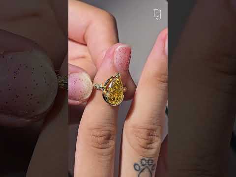 Load video: Yellow Pear Diamond Half Bezel Pave Ring | Earthly Jewels