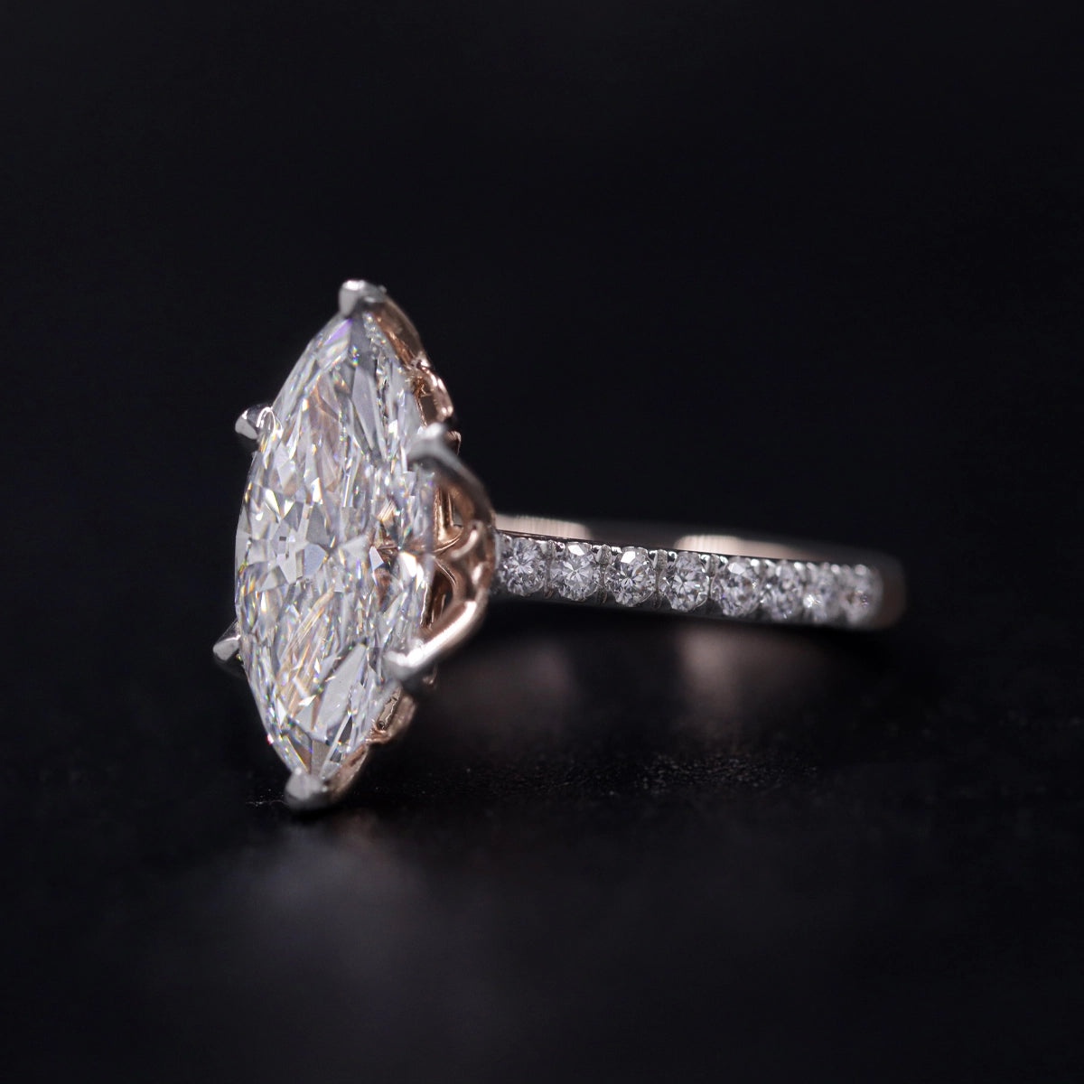 Marquise Solitaire Engagement Ring With Floral Prongs | Earthly Jewels