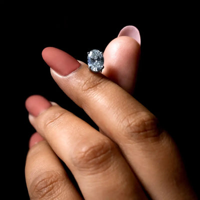 Oval Diamond Solitaire Earrings | Earthly Jewels | Hand Image