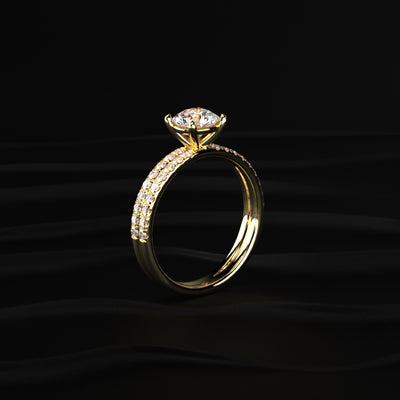 Gold ring with a diamond on a black background