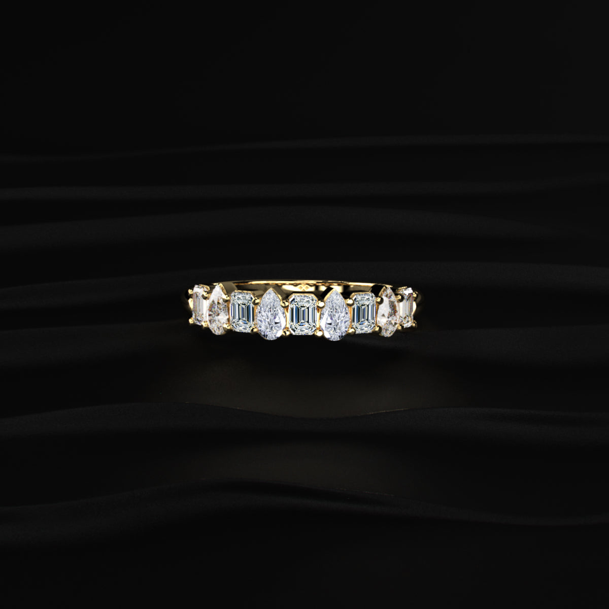 Pear And Emerald Cut Half Eternity Ring | Earthly jewels