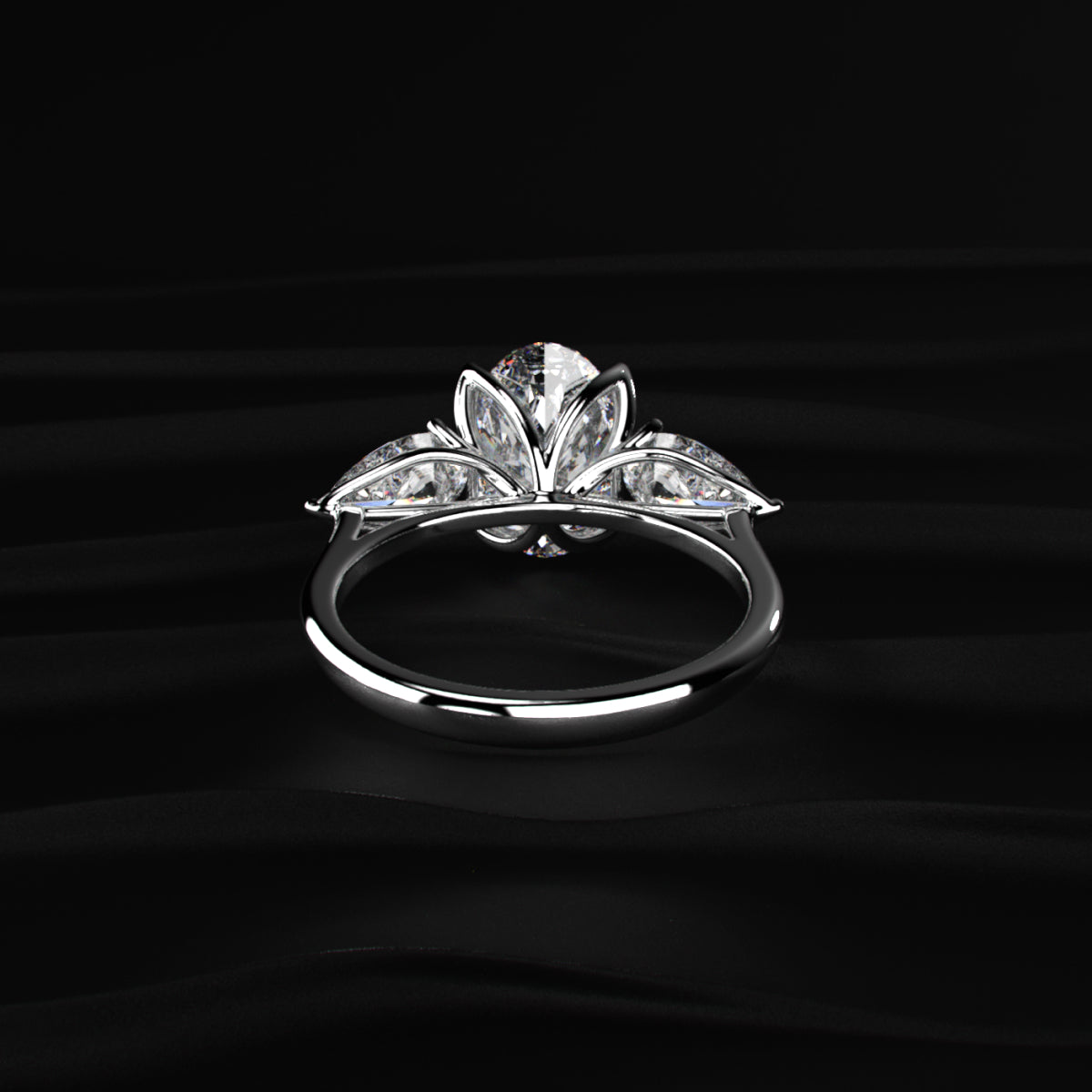 Oval Diamond Triology Ring In Floral Setting With Side Pear
