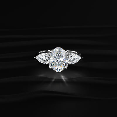 Oval Diamond Triology Ring In Floral Setting With Side Pear | Earthly Jewels