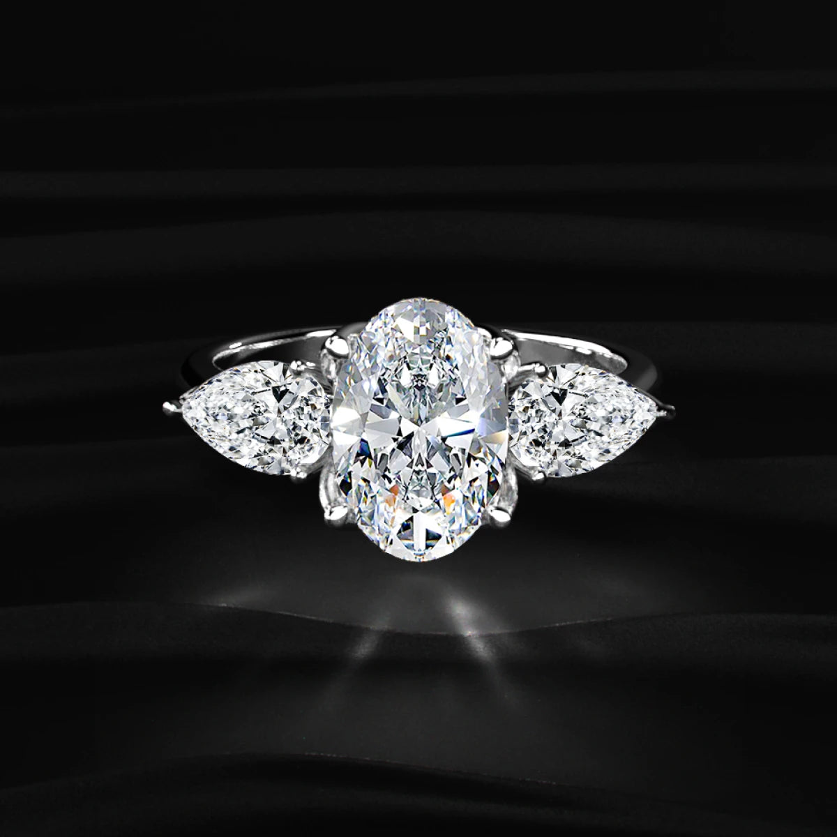 Oval Diamond Triology Ring In Floral Setting With Side Pear | Earthly Jewels