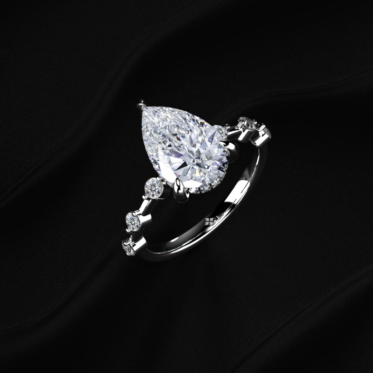 Pear Shaped Diamond Ring With Spaced Stone | Earthly Jewels   