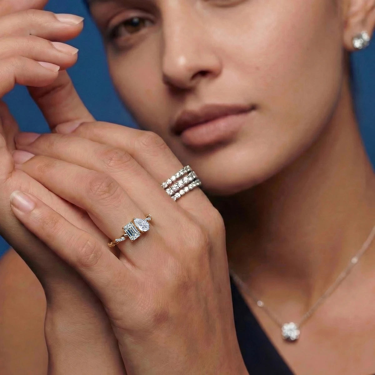 Emerald and Pear Diamond Toi et Moi Ring | Earthly Jewels | Model Image