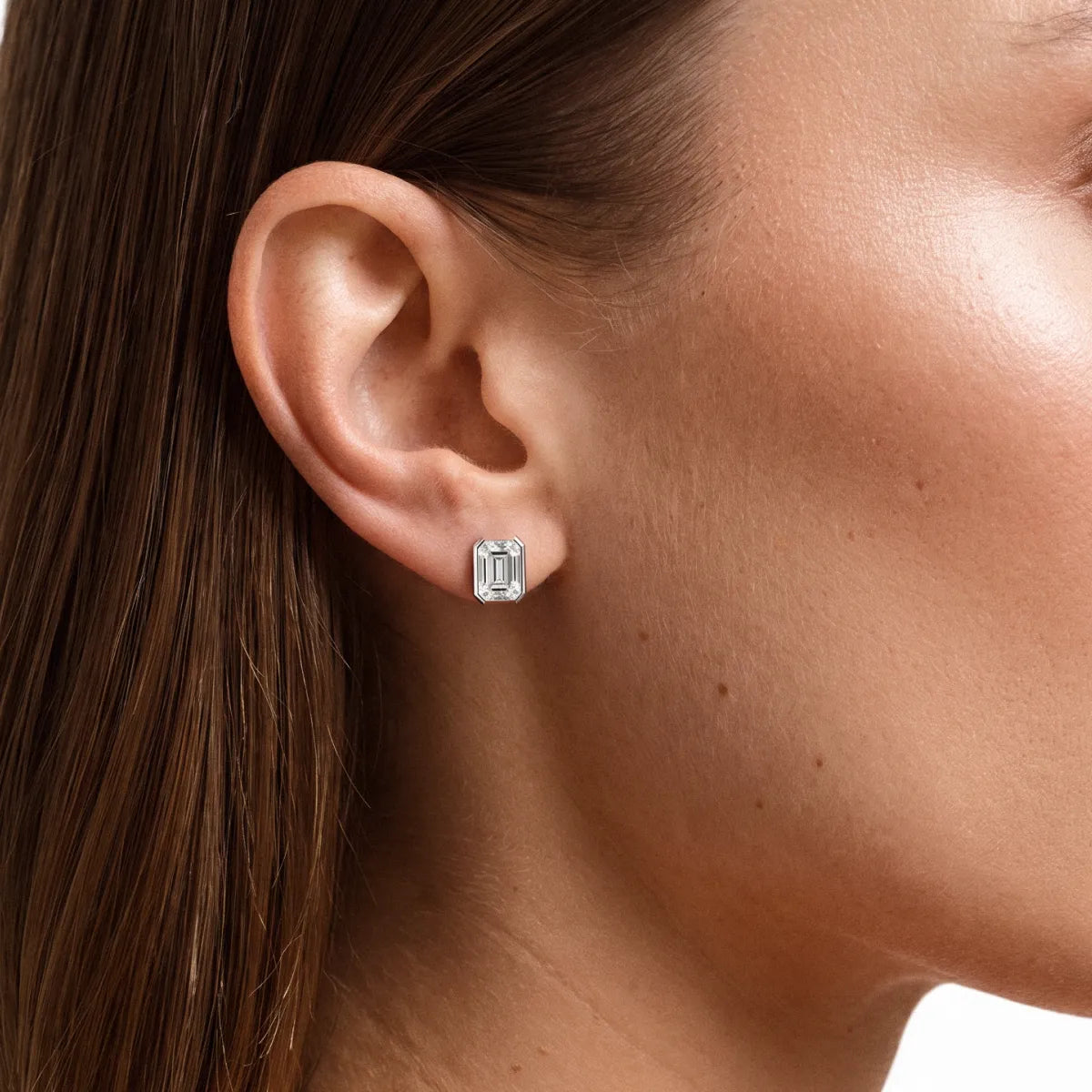 Emerald Cut Diamond Stud Earrings with Half Bezel Setting | Model Image
