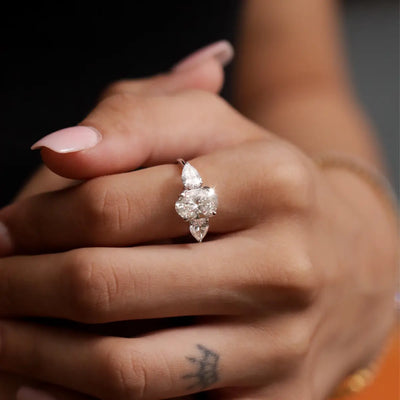 Oval Diamond Triology Ring In Floral Setting With Side Pear | Earthly Jewels